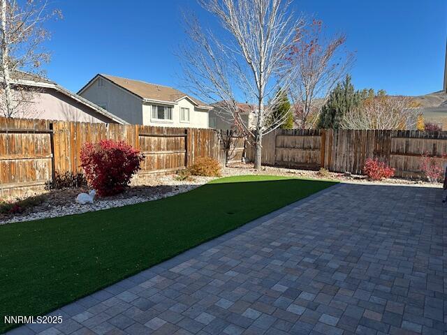 2185 Eagle Greens Drive Reno, NV 89521 - Photo 17 of 22 a front view of a house with a garden and trees