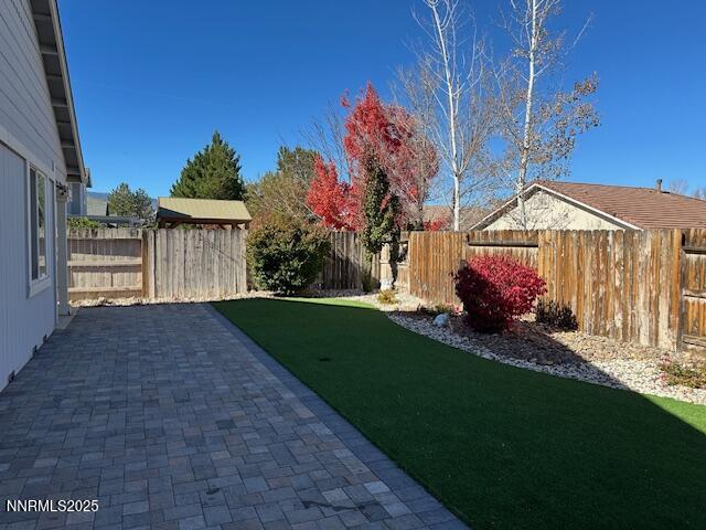 2185 Eagle Greens Drive Reno, NV 89521 - Photo 18 of 22 a view of a house with a small yard and a large tree