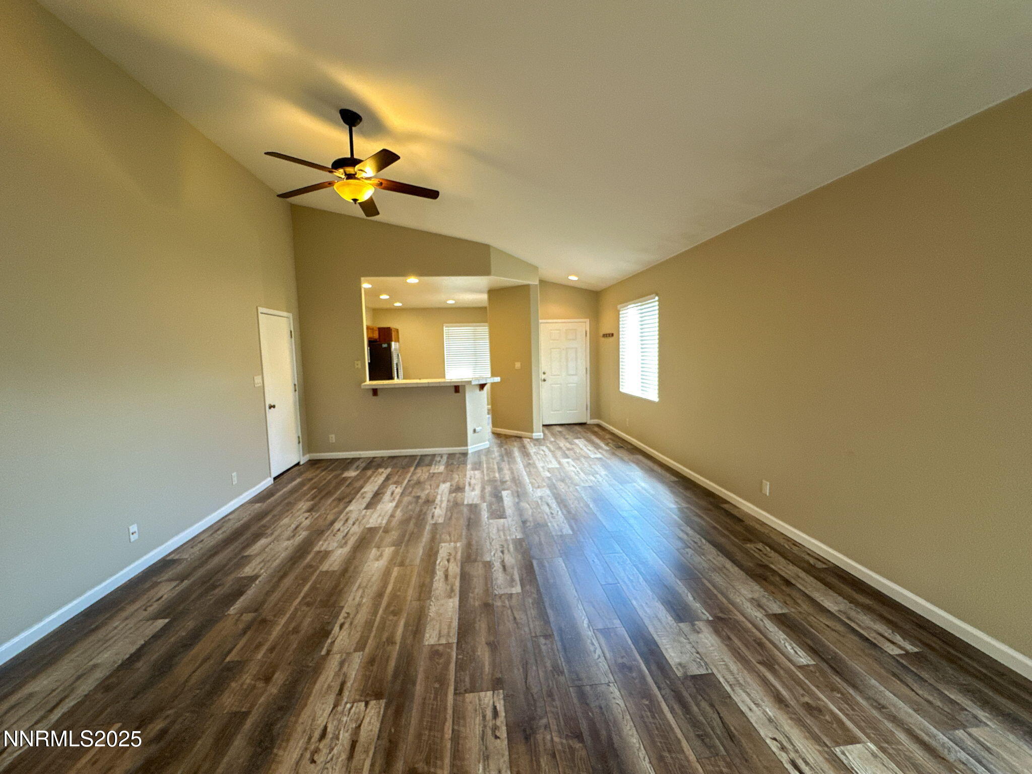 2185 Eagle Greens Drive Reno, NV 89521 - Photo 6 of 22 a view of empty room with wooden floor and fan