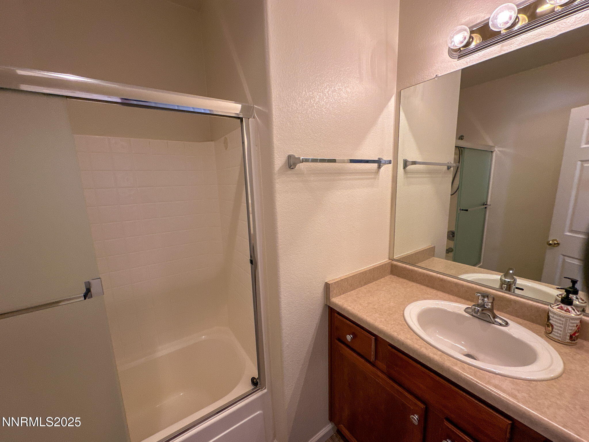2185 Eagle Greens Drive Reno, NV 89521 - Photo 10 of 22 a bathroom with a sink and a mirror