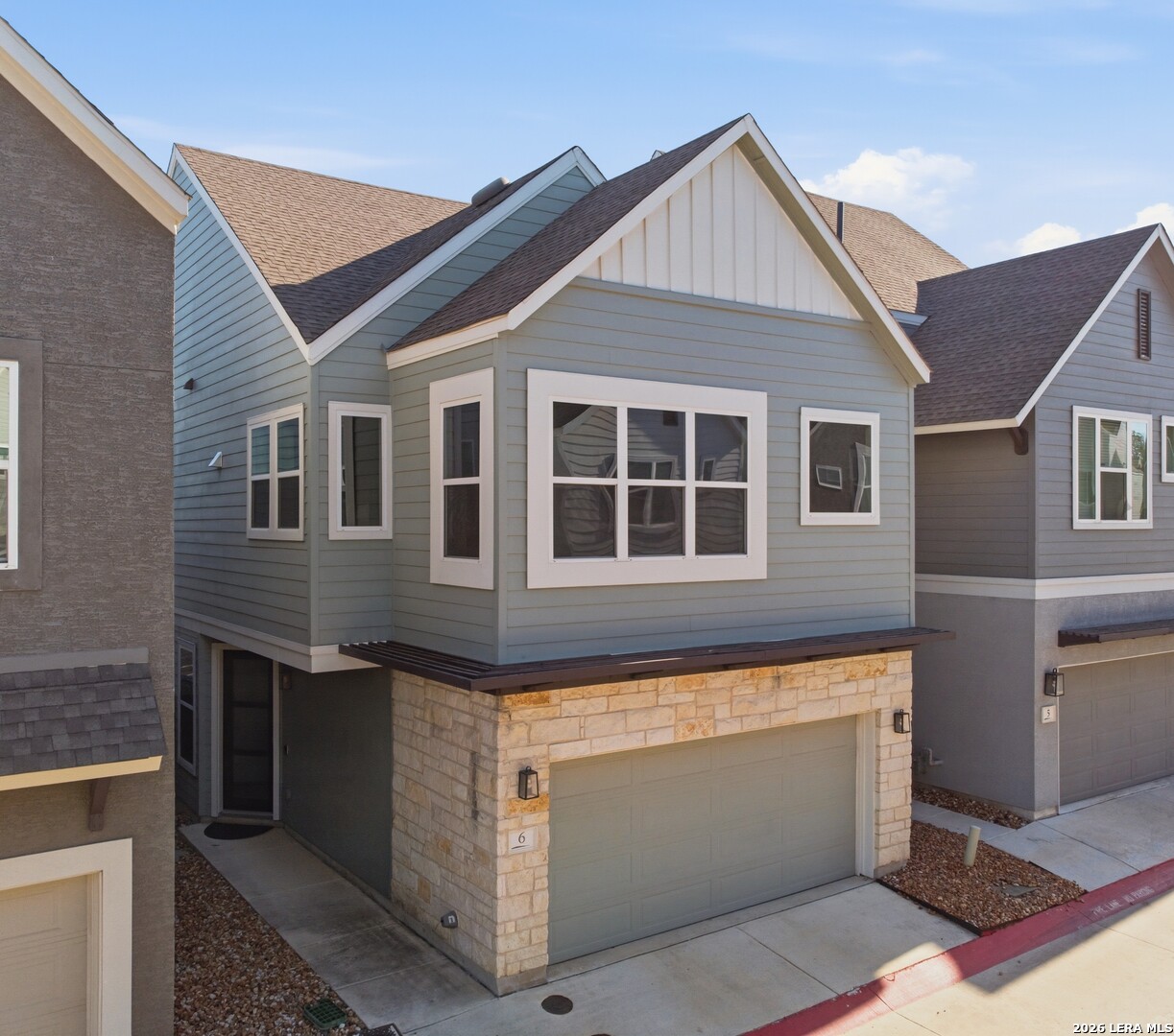 a front view of a house with a garage