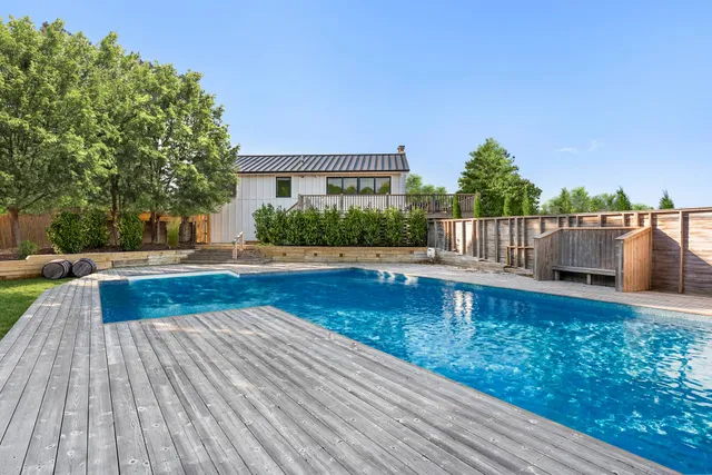 a view of a swimming pool with a patio