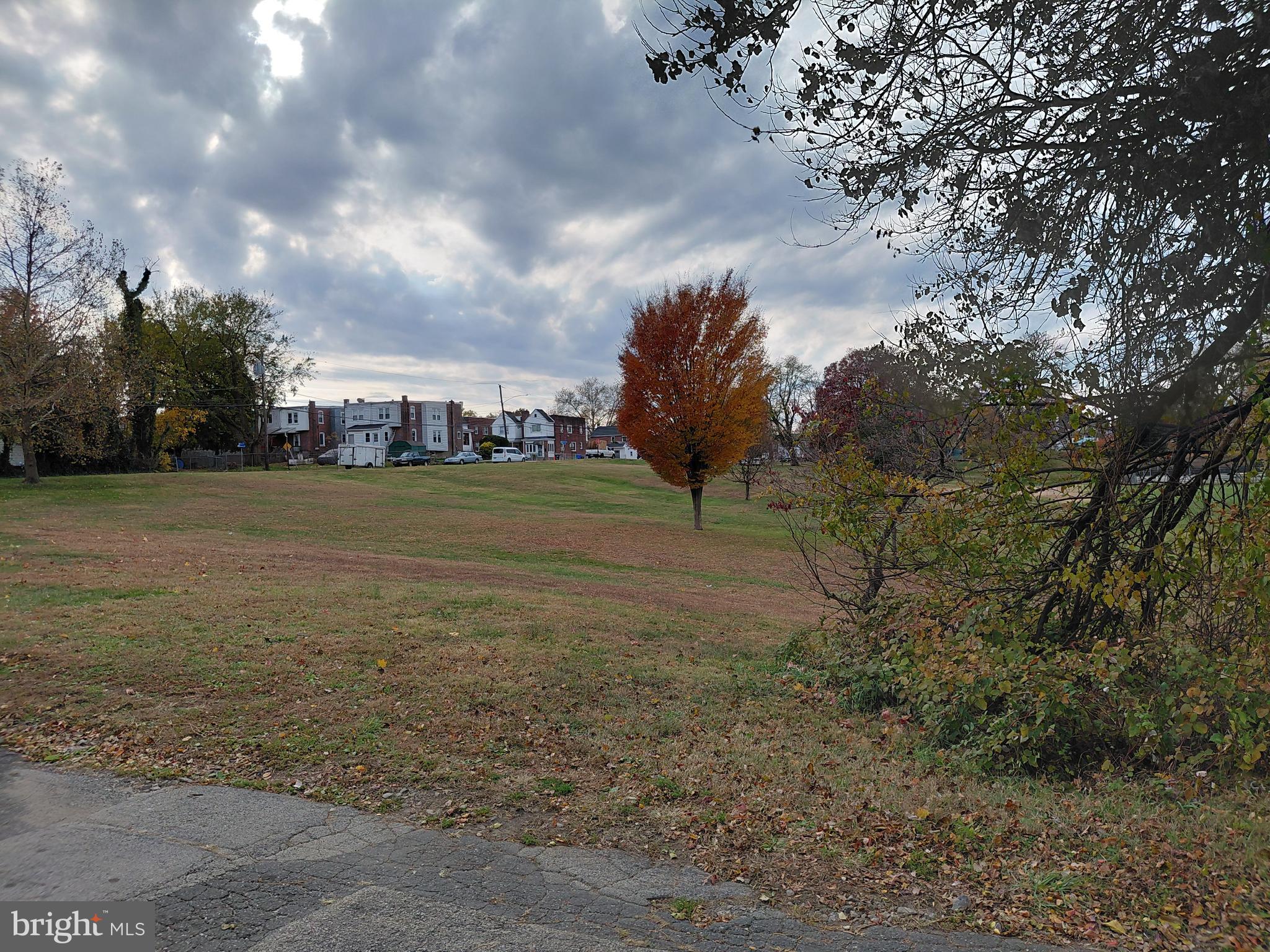 2617 Lindsay Street Chester, PA 19013 - Photo 2 of 10 a view of a field with trees in background