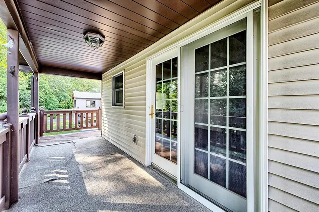 a view of a house with wooden deck