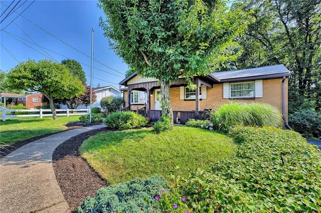 front view of a house with a yard