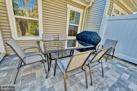 a view of a outdoor seating area with furniture and windows