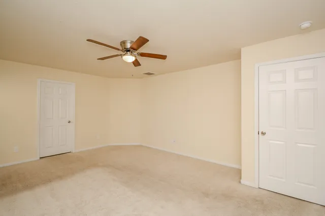 a view of a big room with carpet
