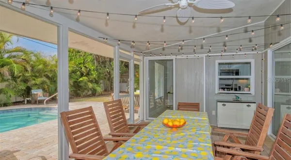 a view of a patio with a table and chairs