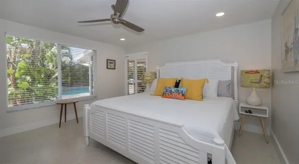 a bedroom with a bed and a table