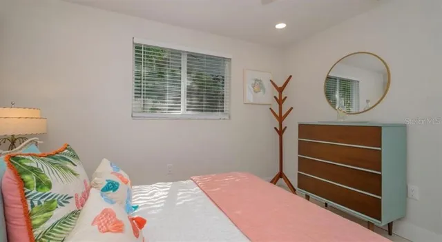 a bedroom with a bed and a dresser