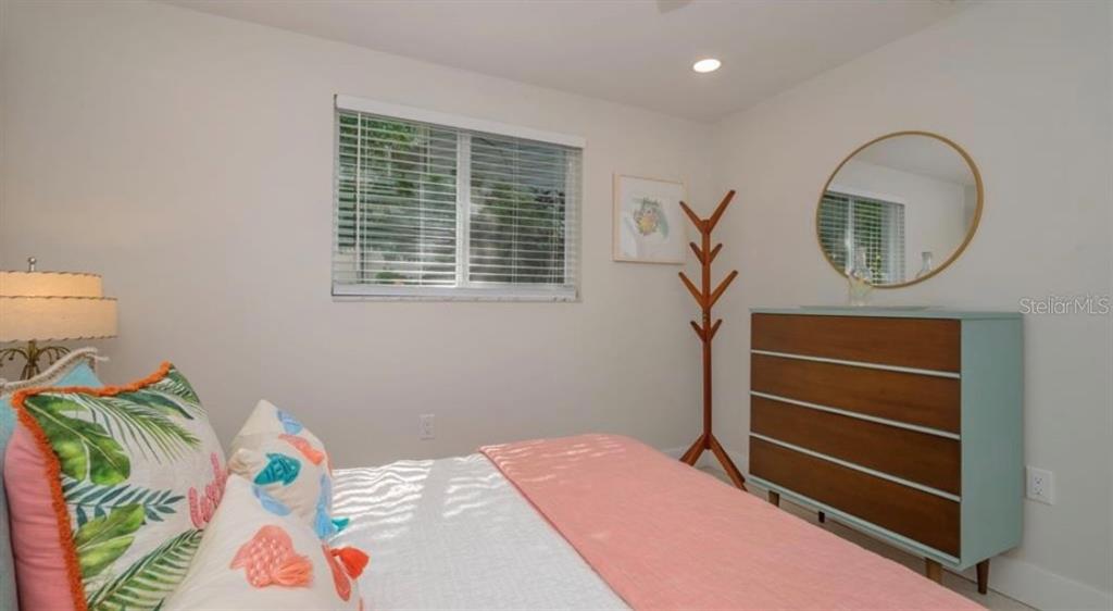 2904 Homasassa Road Sarasota, FL 34239 - Photo 21 of 37 a bedroom with a bed and a dresser