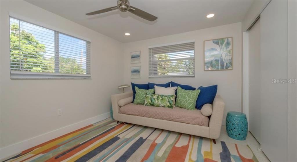 2904 Homasassa Road Sarasota, FL 34239 - Photo 24 of 37 a living room with furniture and a rug