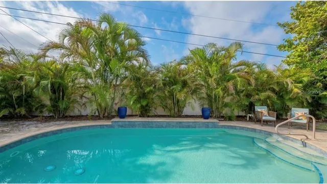 a view of a park with large trees