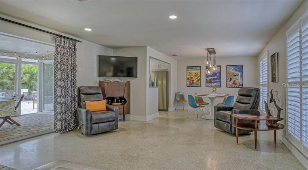 2904 Homasassa Road Sarasota, FL 34239 - Photo 8 of 37 a living room with furniture and a flat screen tv