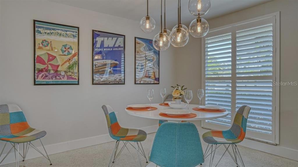 2904 Homasassa Road Sarasota, FL 34239 - Photo 9 of 37 a view of a dining room with furniture and chandelier
