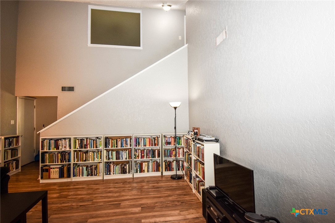 2202 Stagecoach Trail Temple, TX 76502 - Photo 13 of 27 a view of a hallway with wooden floor and staircase
