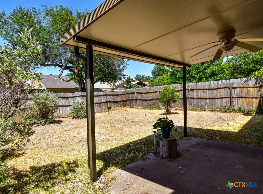 2202 Stagecoach Trail Temple, TX 76502 - Photo 24 of 27 a view of a porch with a floor to ceiling window next to a yard