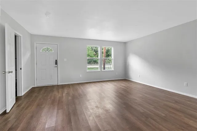 a kitchen with stainless steel appliances granite countertop white cabinets a sink and a stove