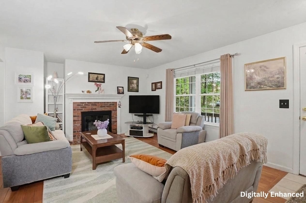 186 Common Street Groton, MA 01450 - Photo 6 of 28 a living room with furniture and a fireplace