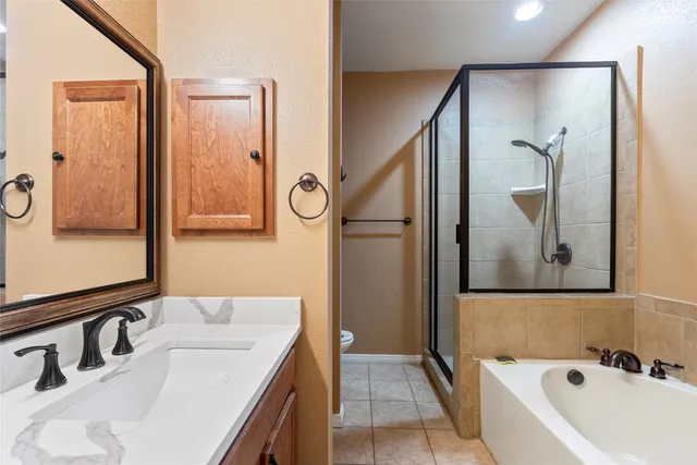 a bathroom with a tub sink and mirror