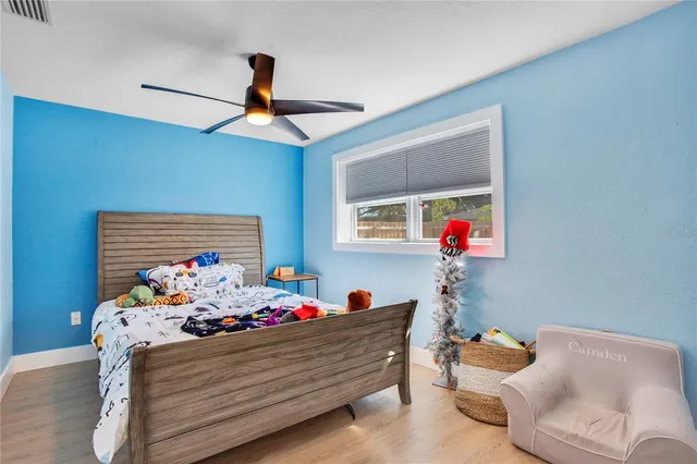 a bed room with furniture and a chandelier