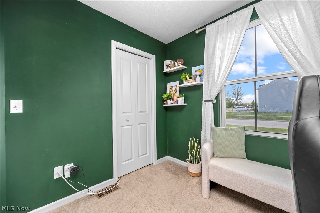 2161 Fowl Road Elyria, OH 44035 - Photo 26 of 46 Carpeted bedroom with a bi-fold closet door and a large window