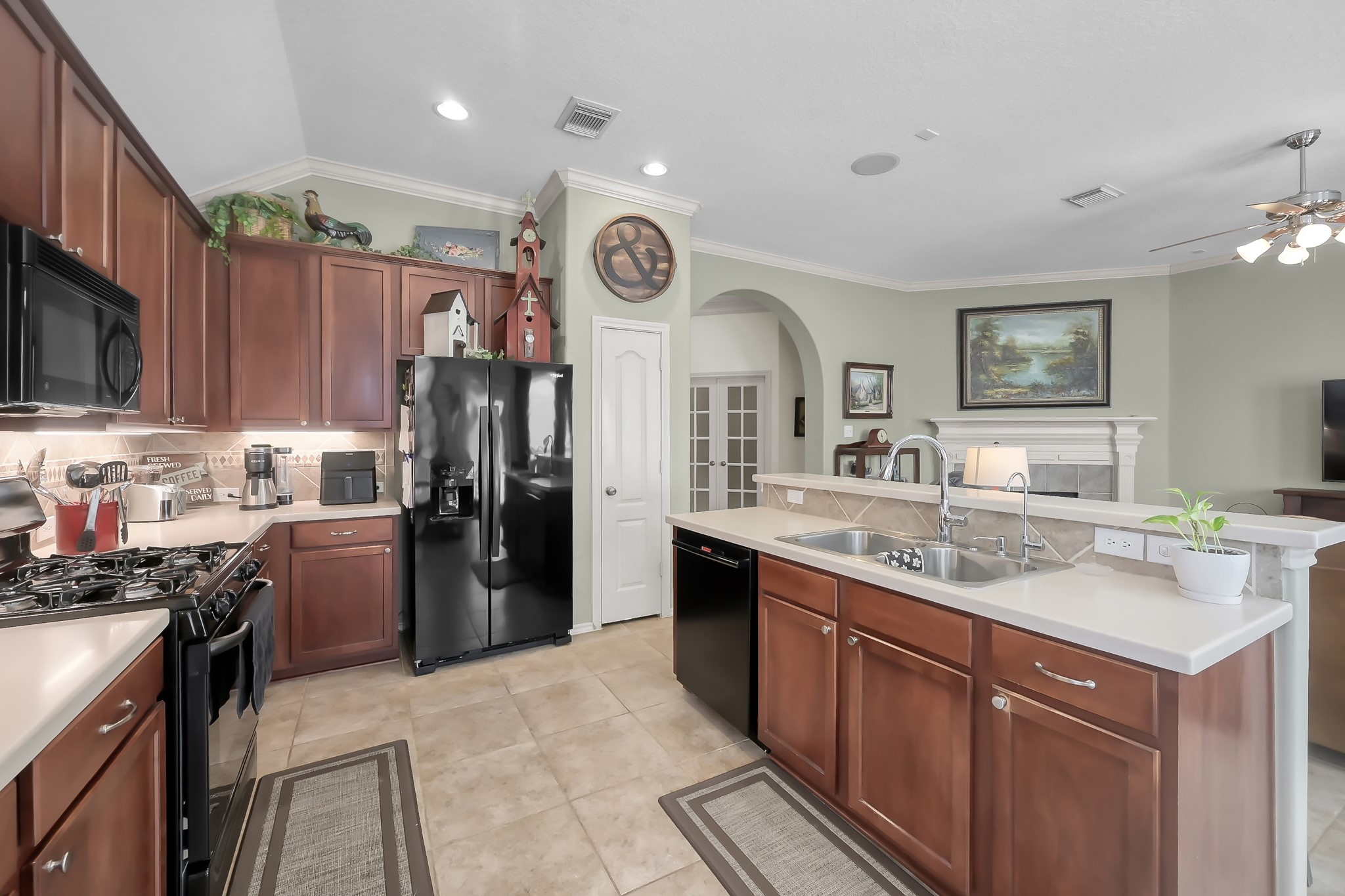 2318 Caroline Park Lane Spring, TX 77386 - Photo 18 of 38 a kitchen with a sink cabinets and stainless steel appliances