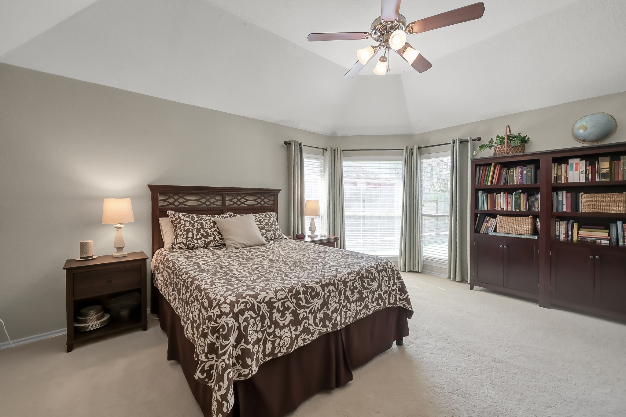2318 Caroline Park Lane Spring, TX 77386 - Photo 24 of 38 a bedroom with a bed window and a chandelier