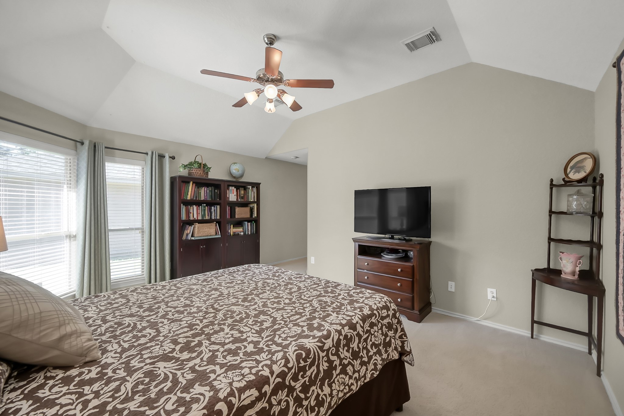 2318 Caroline Park Lane Spring, TX 77386 - Photo 25 of 38 a bedroom with a bed and a flat screen tv