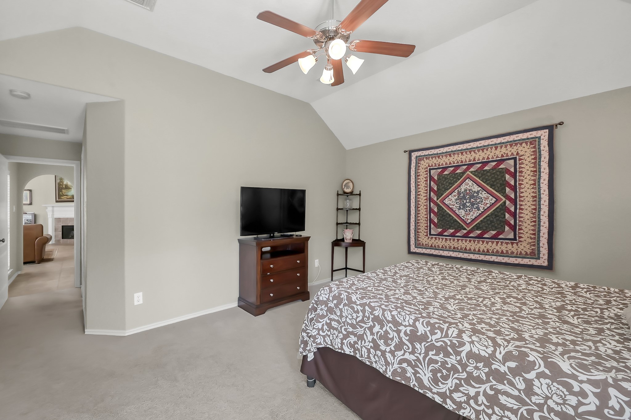 2318 Caroline Park Lane Spring, TX 77386 - Photo 26 of 38 a bedroom with furniture and a flat screen tv