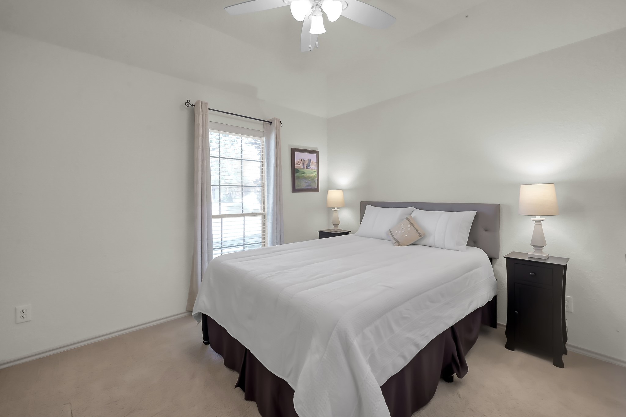 2318 Caroline Park Lane Spring, TX 77386 - Photo 29 of 38 a bedroom with a bed and a chandelier