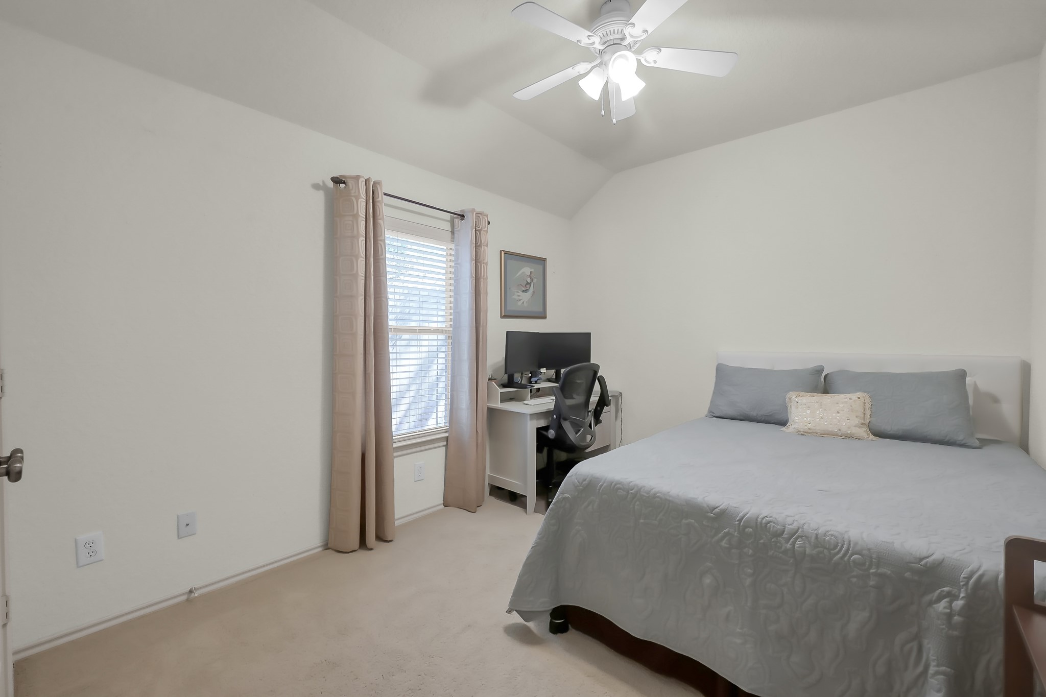 2318 Caroline Park Lane Spring, TX 77386 - Photo 32 of 38 a bedroom with a bed and a chandelier