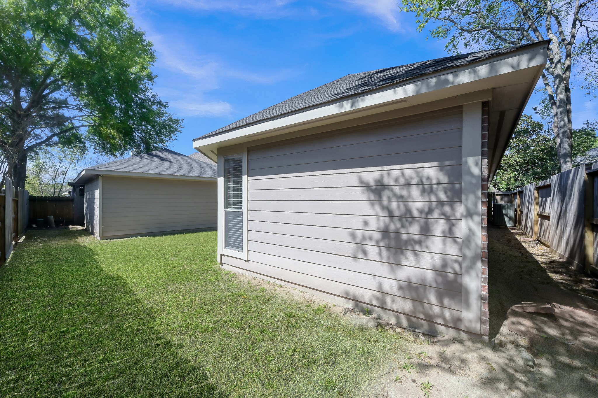 2318 Caroline Park Lane Spring, TX 77386 - Photo 35 of 38 a backyard of a house with lots of green space