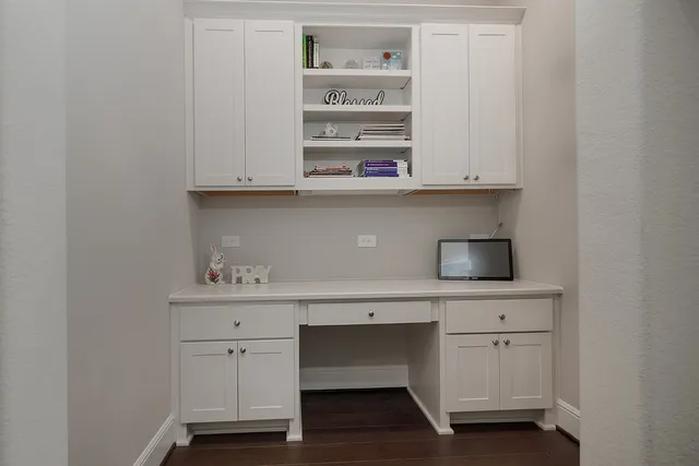 a view of cabinets with wooden floor