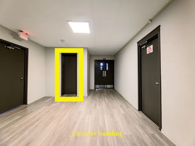 a view of hallway with wooden floor