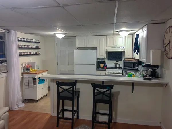 a kitchen with stainless steel appliances a sink stove and refrigerator