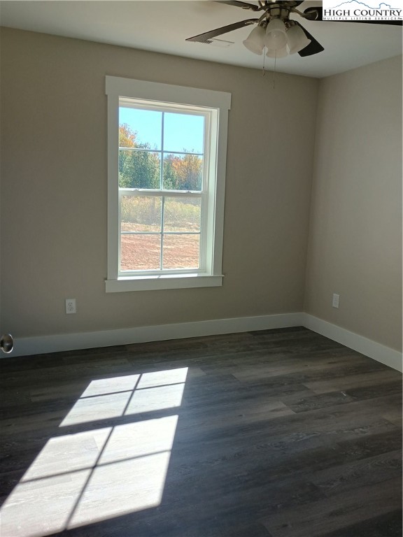 90 Millards Way Sparta, NC 28675 - Photo 7 of 8 a view of wooden floor and windows in a room