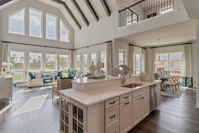 a view of a kitchen counter top space with furniture and wooden floor