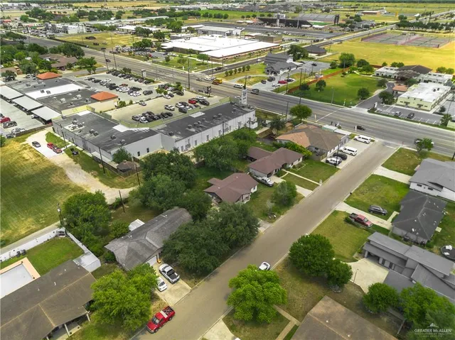 an aerial view of residential houses with outdoor space
