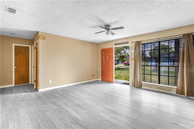 a view of an empty room with a window