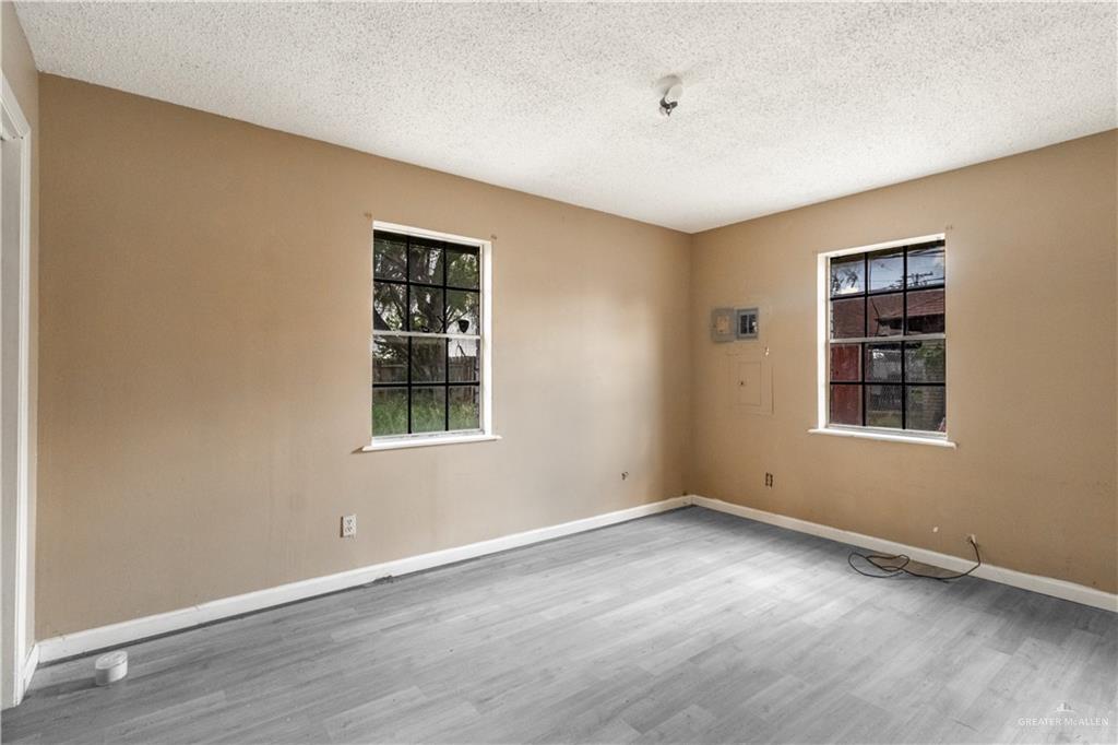 1802 Hunt Avenue Donna, TX 78537 - Photo 9 of 10 a view of wooden floor and windows in a room