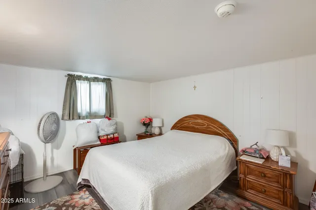 a bedroom with a bed and window