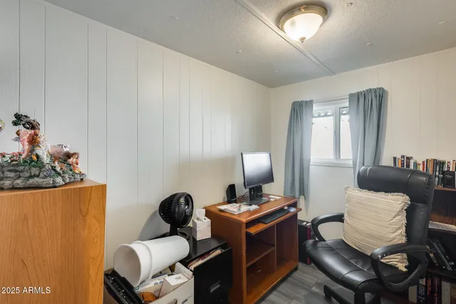 a living room with furniture a couch and a potted plant