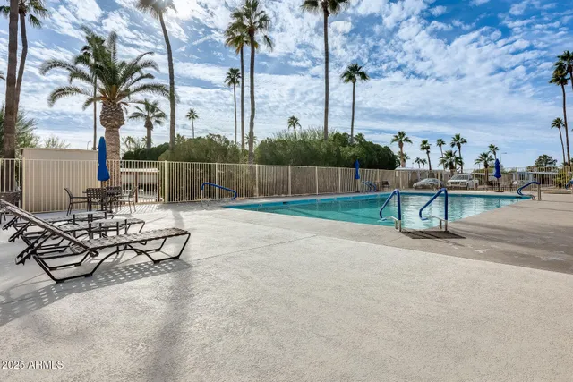 a kitchen with refrigerator cabinets and wooden floor