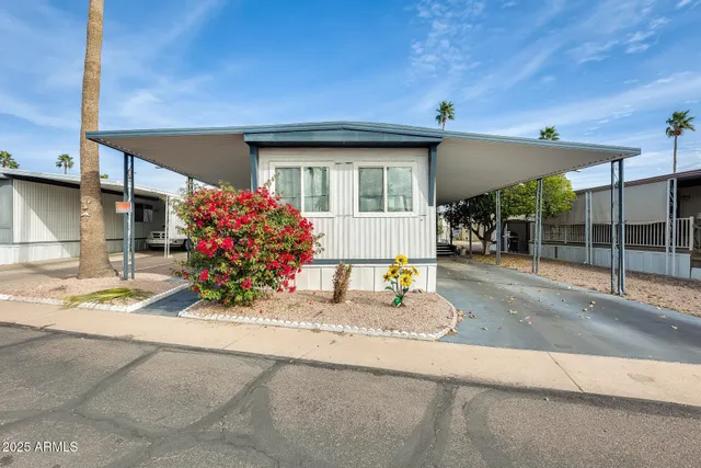 a front view of a house with a porch and a yard