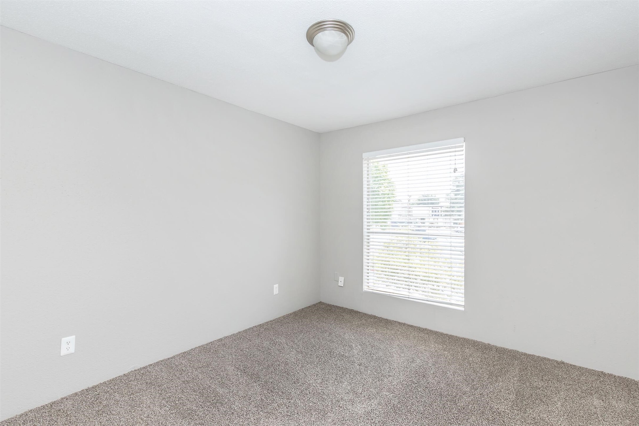 18001 Cypress Trace Road, Unit 607 Houston, TX 77090 - Photo 13 of 32 an empty room with windows
