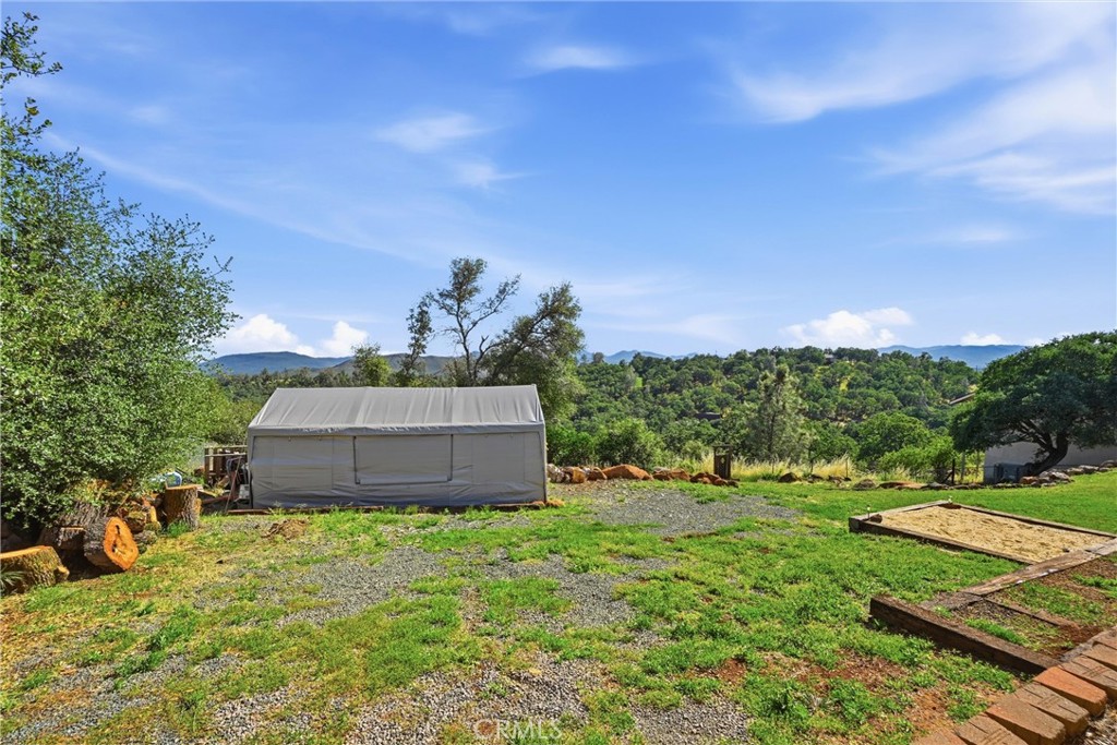 20257 Indian Rock Road Hidden Valley Lake, CA 95467 - Photo 24 of 33 Wood storage area at rear of property.