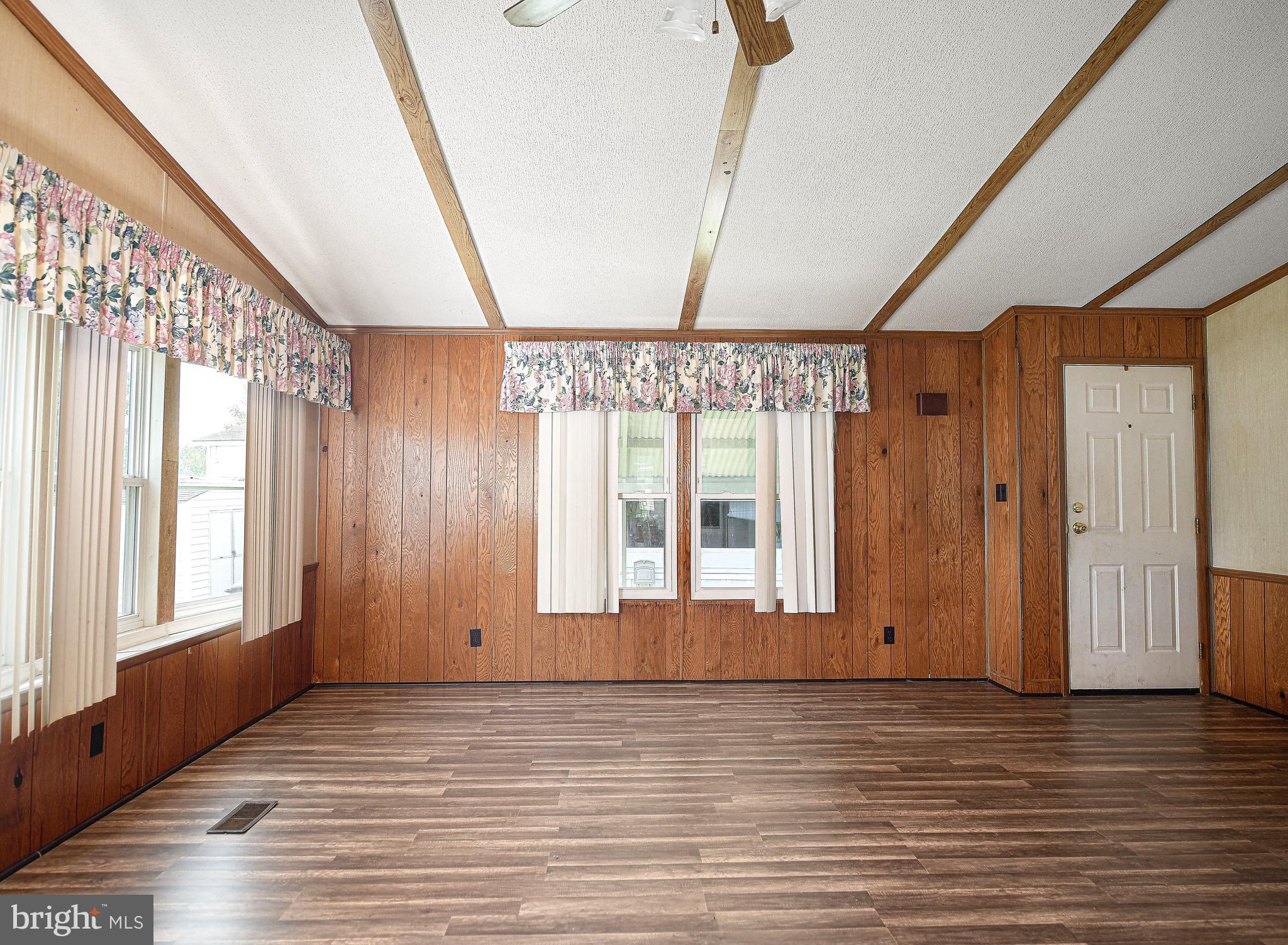 107 Lariat Road Middle River, MD 21220 - Photo 5 of 28 Living room with wood paneling