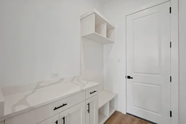 a view of cabinets and wooden floor
