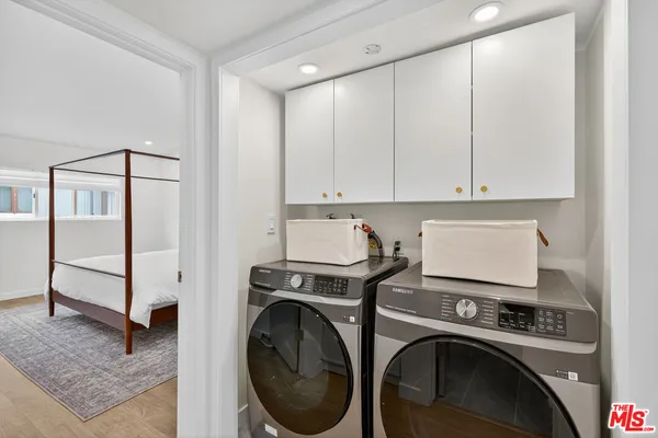 a view of a storage & utility room with washer and dryer